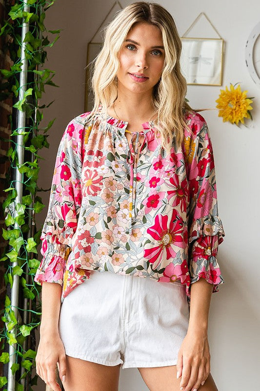 Floral print spring top with ruffle detail sleeve & cinched tie neckline