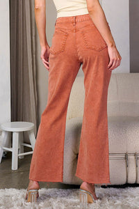 Fall rust colored wide leg jeans with frayed bottom detail