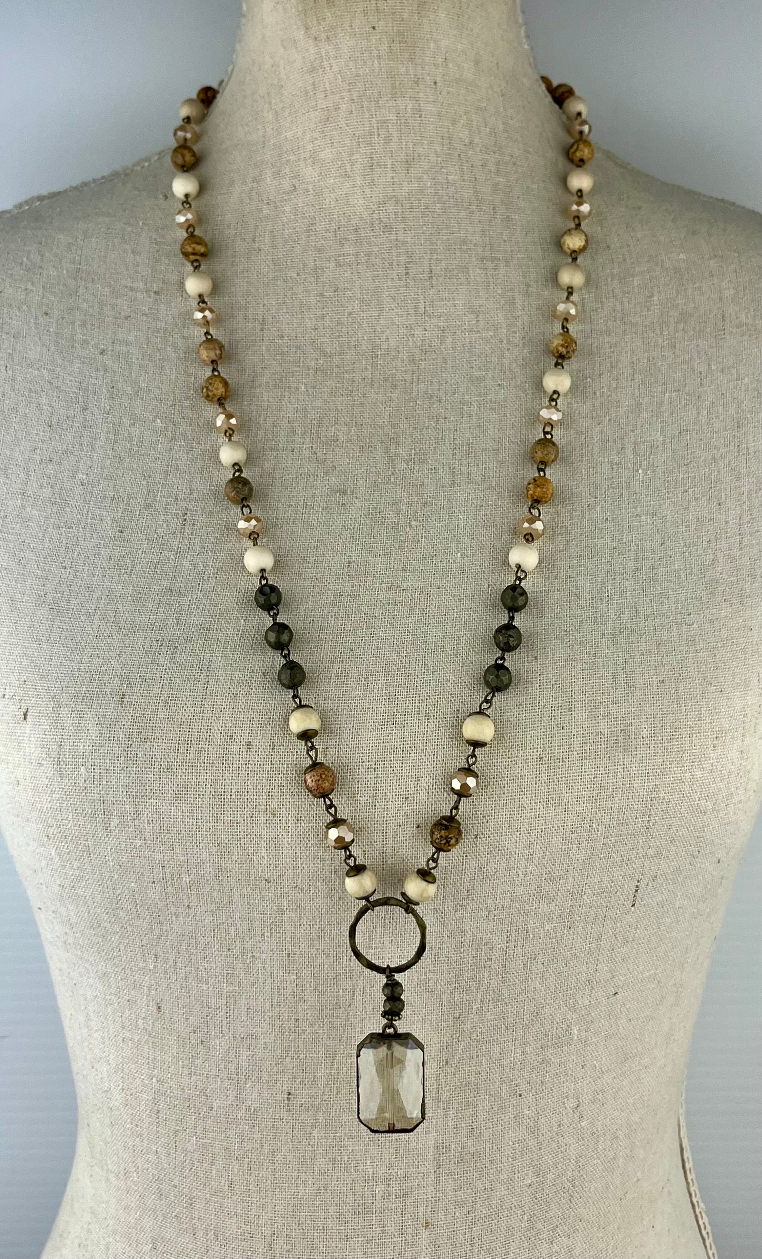 Brown and cream jeweled long necklace