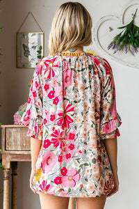 Floral print spring top with ruffle detail sleeve & cinched tie neckline